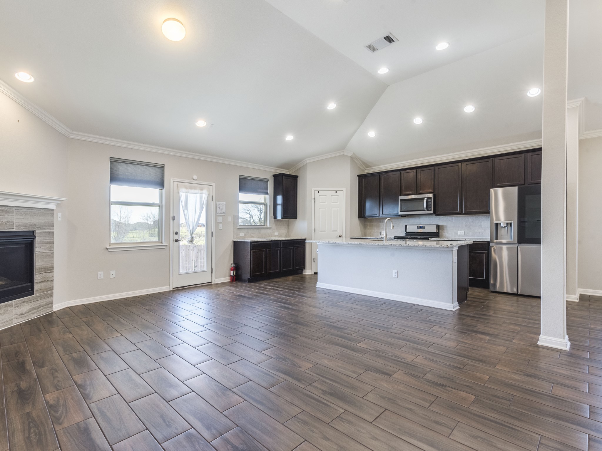 6829 Banff Cove Austin, TX 78754 - Photo 5 of 39 a view of kitchen with cabinets and wooden floor