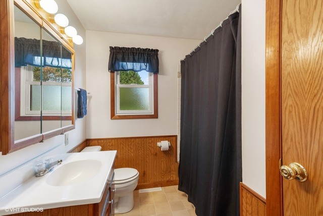 15809 Maple Park Road Maple Park, IL 60151 - Photo 13 of 19 a bathroom with a sink and a mirror