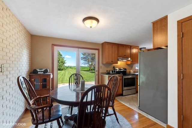 15809 Maple Park Road Maple Park, IL 60151 - Photo 5 of 19 a dining room with furniture and window
