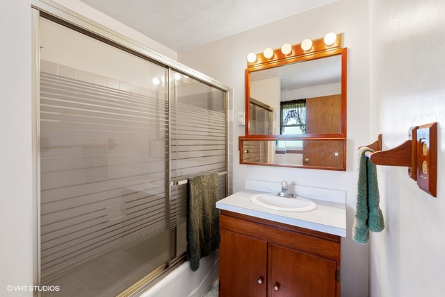 15809 Maple Park Road Maple Park, IL 60151 - Photo 10 of 19 a bathroom with a sink and a mirror