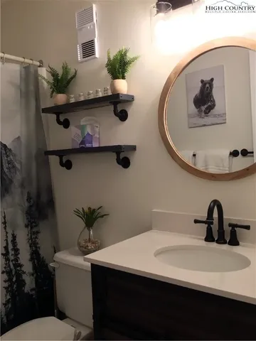 a view of bathroom sink and mirror