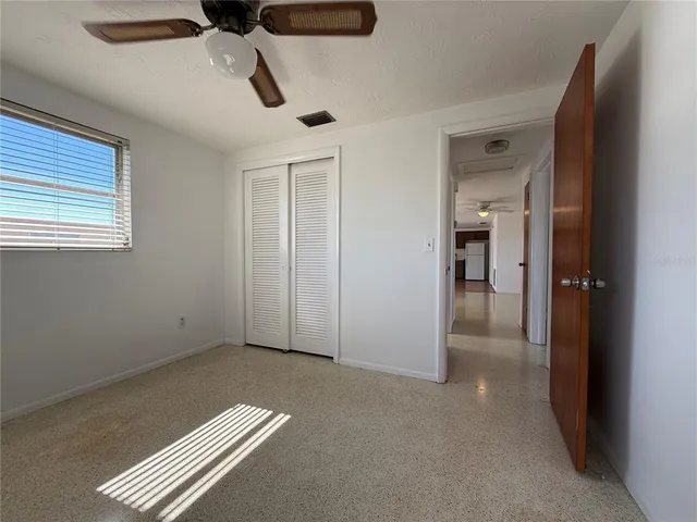 a view of a hallway with furniture