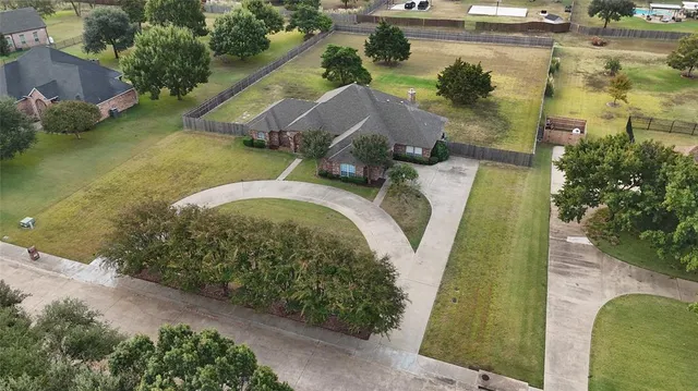 an aerial view of a house with outdoor space