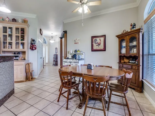 a dining room with furniture and window