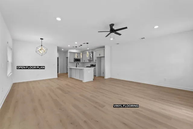 a view of a kitchen with a sink and a refrigerator