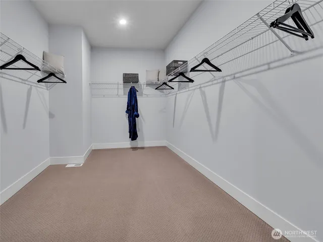 a view of a room with stairs and a window