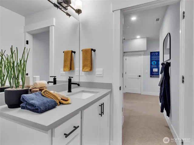 a kitchen with a sink and a refrigerator
