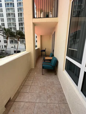 a room with gym equipment and windows