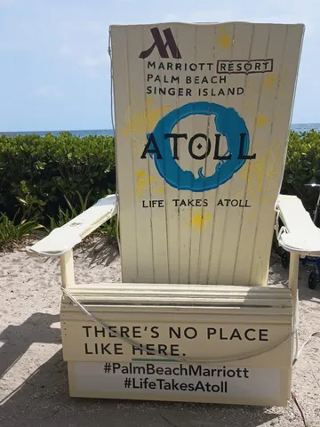 a group of couches sitting under a large umbrella