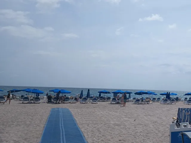 a backyard of a house with barbeque oven table and chairs