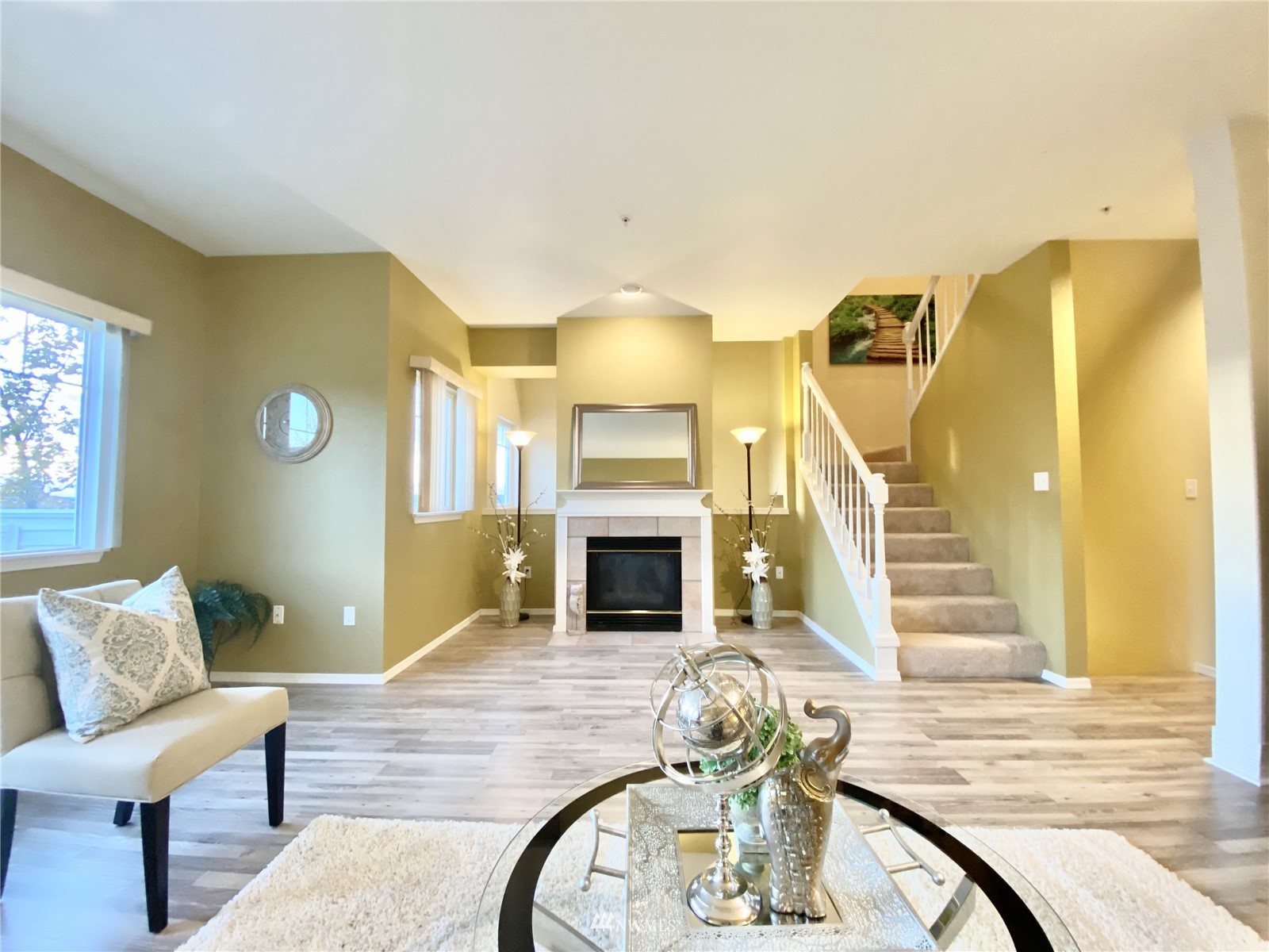 4700 Talbot Road South, Unit 4604 Renton, WA 98055 - Photo 8 of 22 a living room with furniture and a fireplace