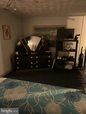 a view of backyard with a deck and furniture