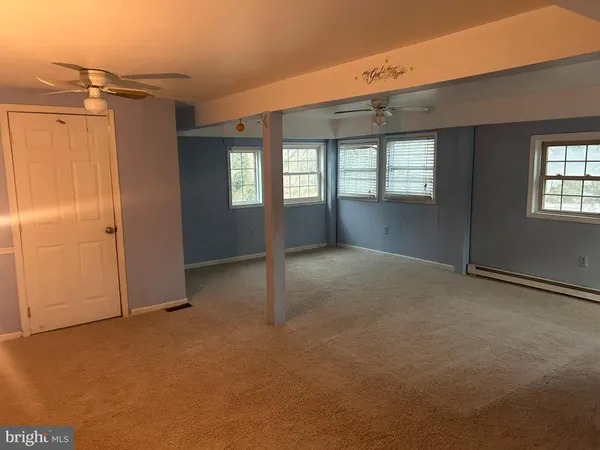 an empty room with windows