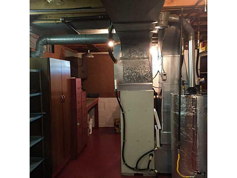 3430 Morefield Road Hermitage, PA 16148 - Photo 22 of 25 Basement/Game Room. Furnace, hot water heater with NASA aluminum insulation