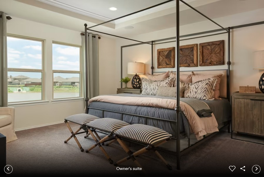 298 Begonia Street Buda, TX 78610 - Photo 7 of 12 a bedroom with a bed and wooden floor