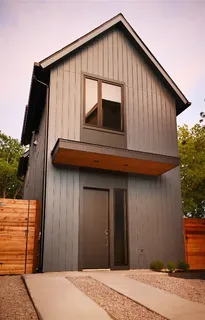 a house with trees in the background