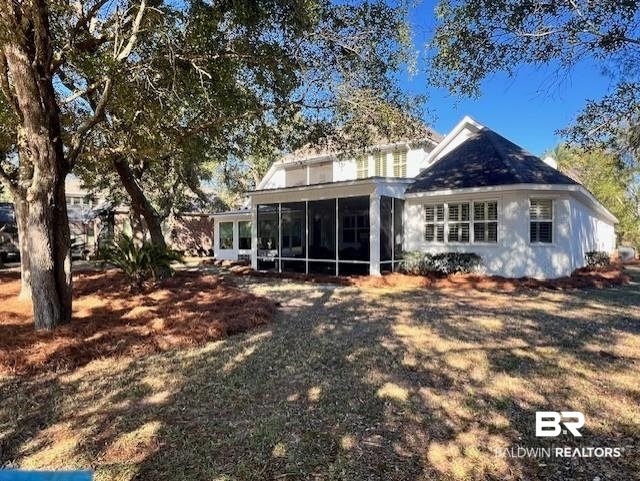404 Peninsula Boulevard Gulf Shores, AL 36542 - Photo 41 of 51 Back of house with a sunroom