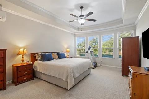 a bathroom with a granite countertop sink a mirror and shower