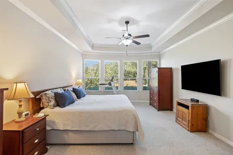 a en suite bathroom with a double vanity sink a mirror and a shower