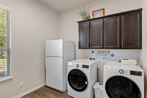 a room with gym equipment and a large window