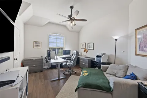a bedroom with a bed and a table in it