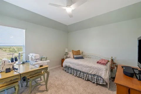 a view of a sitting area with furniture in backyard