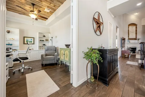 a view of a livingroom with furniture and a flat screen tv
