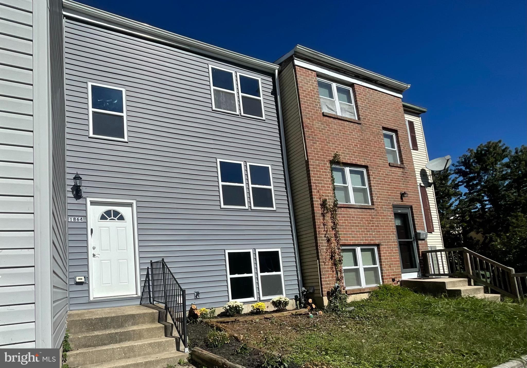 a front view of house with street