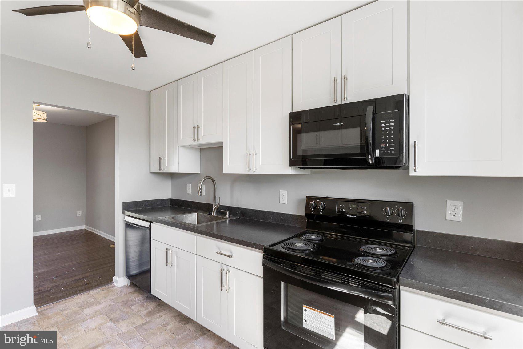 1864 Simons Court Edgewood, MD 21040 - Photo 12 of 28 a kitchen with stainless steel appliances granite countertop grey cabinets a stove a sink and dishwasher