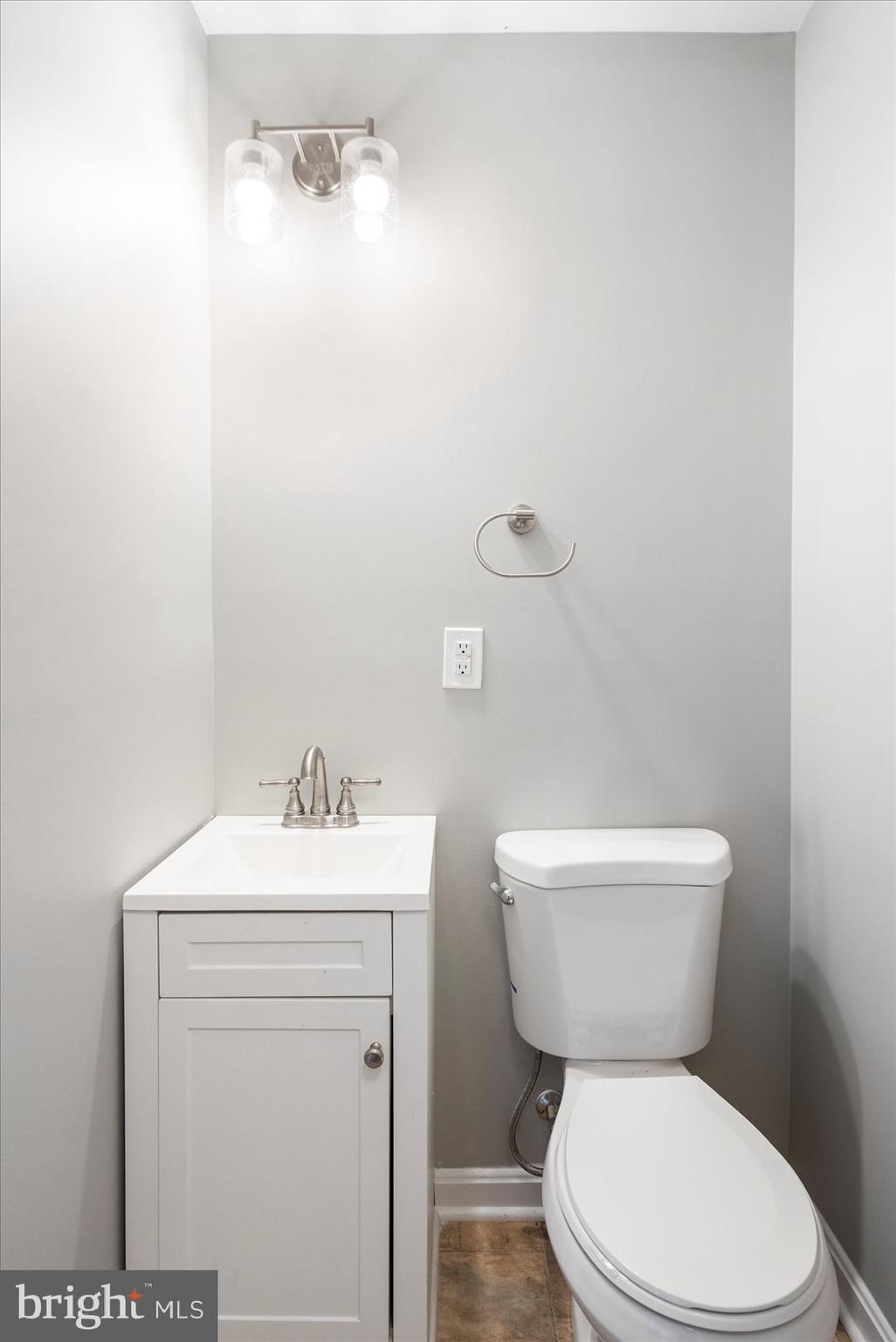 1864 Simons Court Edgewood, MD 21040 - Photo 14 of 28 a white toilet sitting next to a bathroom sink