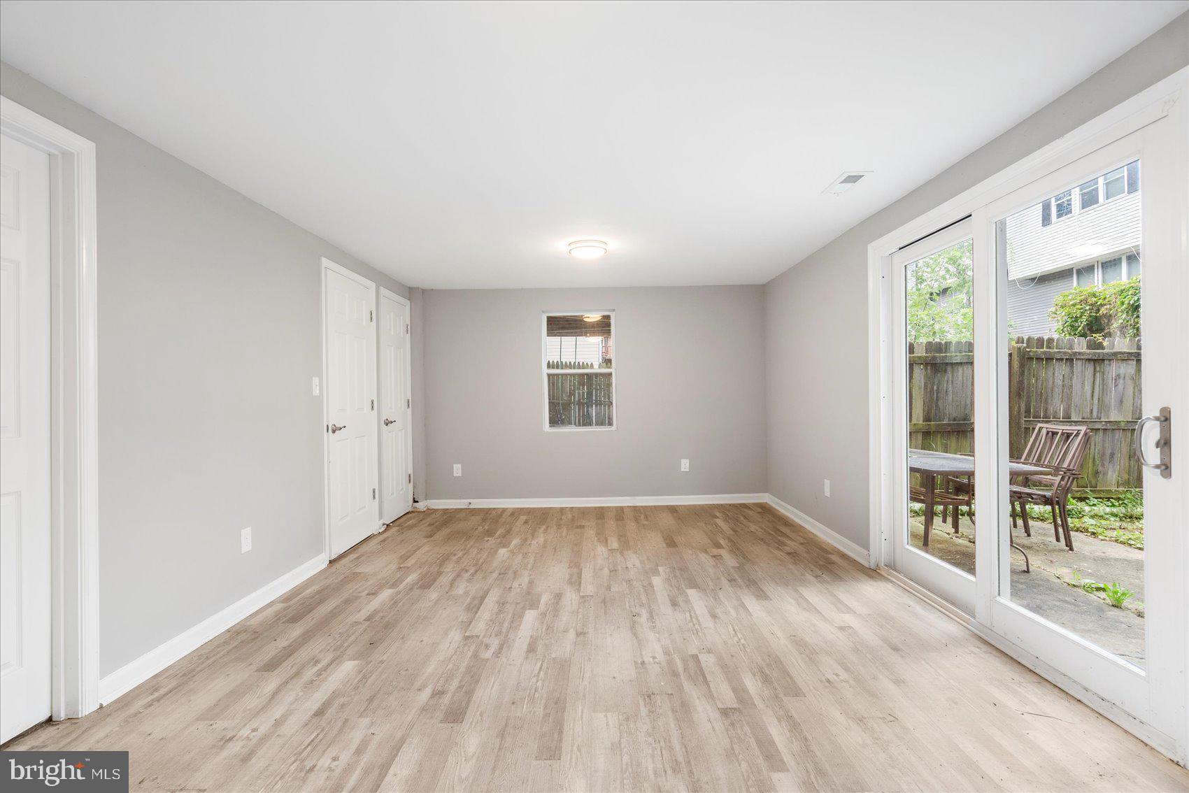 1864 Simons Court Edgewood, MD 21040 - Photo 25 of 28 an empty room with wooden floor and windows