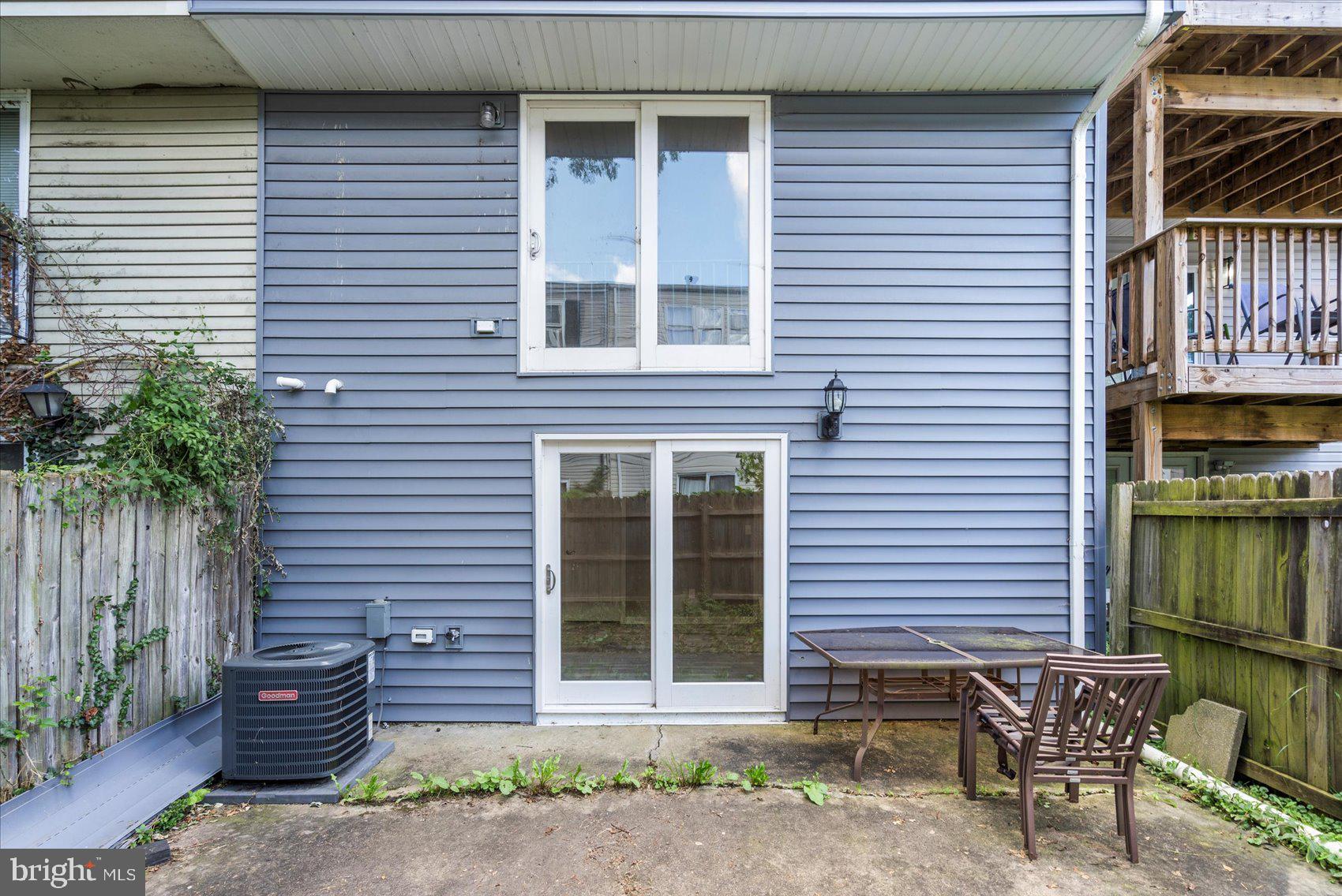 1864 Simons Court Edgewood, MD 21040 - Photo 27 of 28 a wooden bench sitting in front of a house