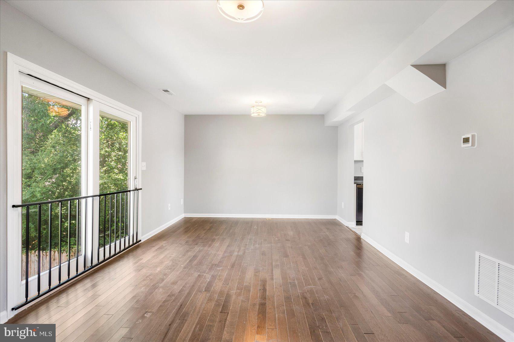 1864 Simons Court Edgewood, MD 21040 - Photo 3 of 28 a view of a big room with wooden floor and windows