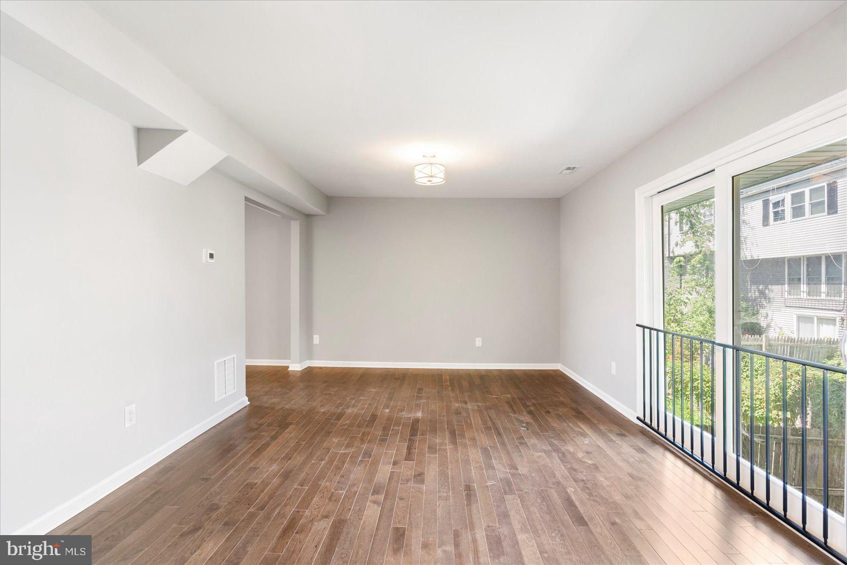 1864 Simons Court Edgewood, MD 21040 - Photo 5 of 28 a view of a room with wooden floor and windows