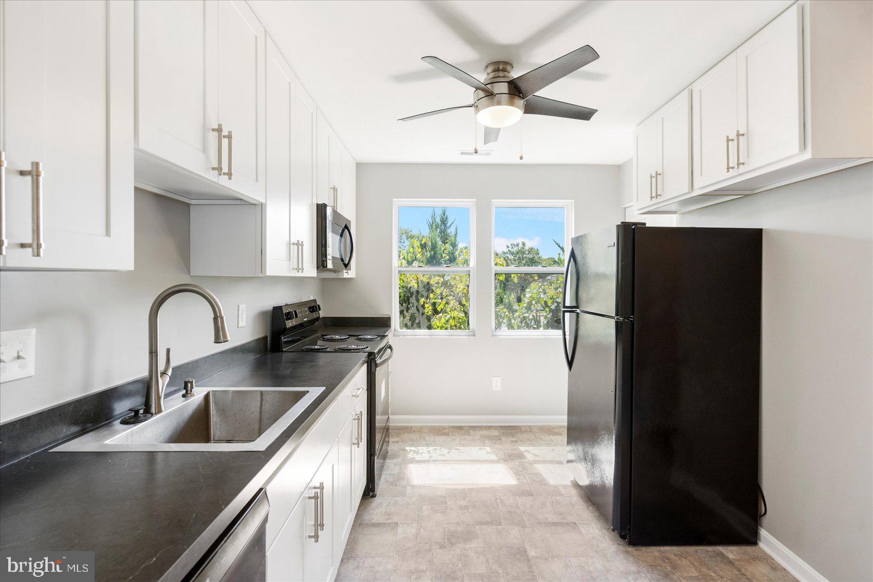1864 Simons Court Edgewood, MD 21040 - Photo 7 of 28 a kitchen with stainless steel appliances granite countertop a refrigerator a sink a stove a microwave and cabinets