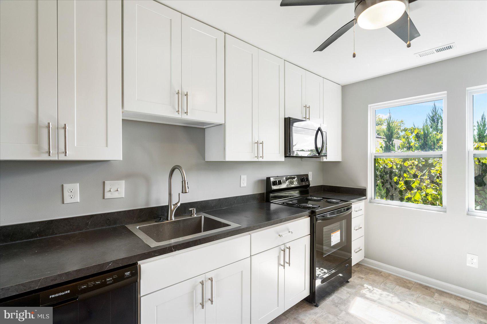 1864 Simons Court Edgewood, MD 21040 - Photo 8 of 28 a kitchen with stainless steel appliances granite countertop a sink a stove and a granite counter tops