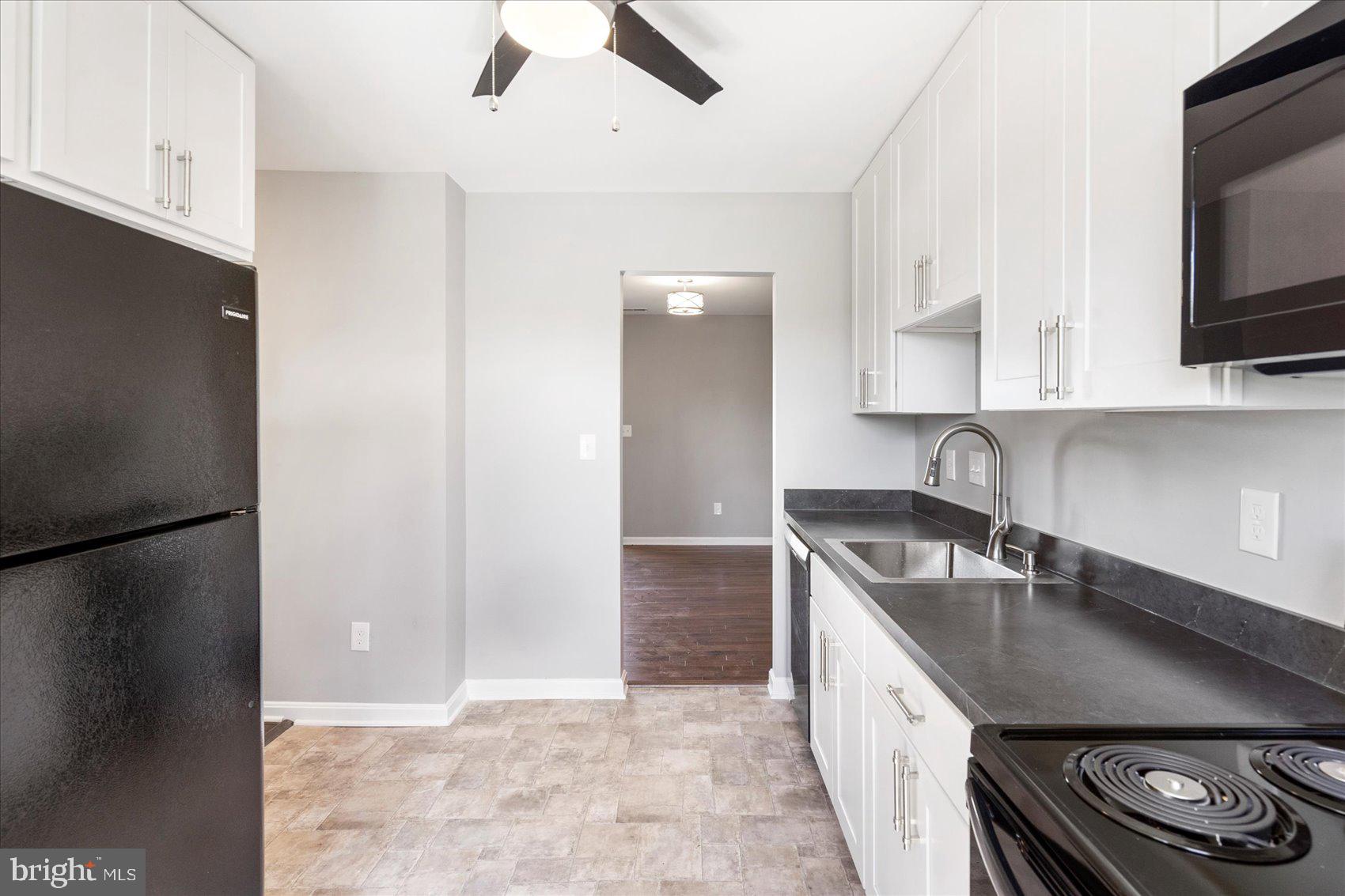 1864 Simons Court Edgewood, MD 21040 - Photo 10 of 28 a kitchen with stainless steel appliances a sink stove and refrigerator