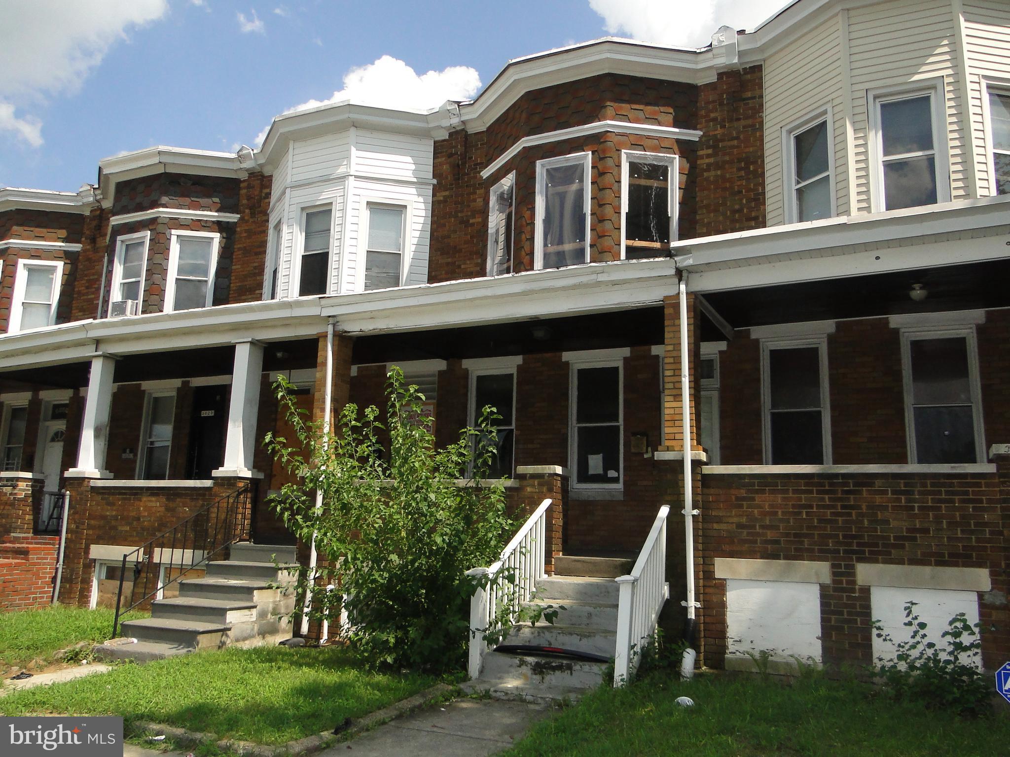 3019 Belair Road Baltimore, MD 21213 - Photo 1 of 11 front view of a house with a yard
