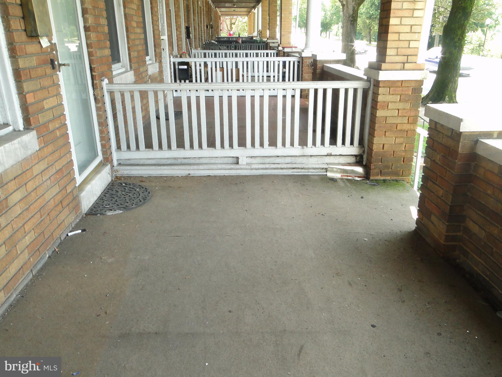 3019 Belair Road Baltimore, MD 21213 - Photo 2 of 11 a view of a porch with a bench