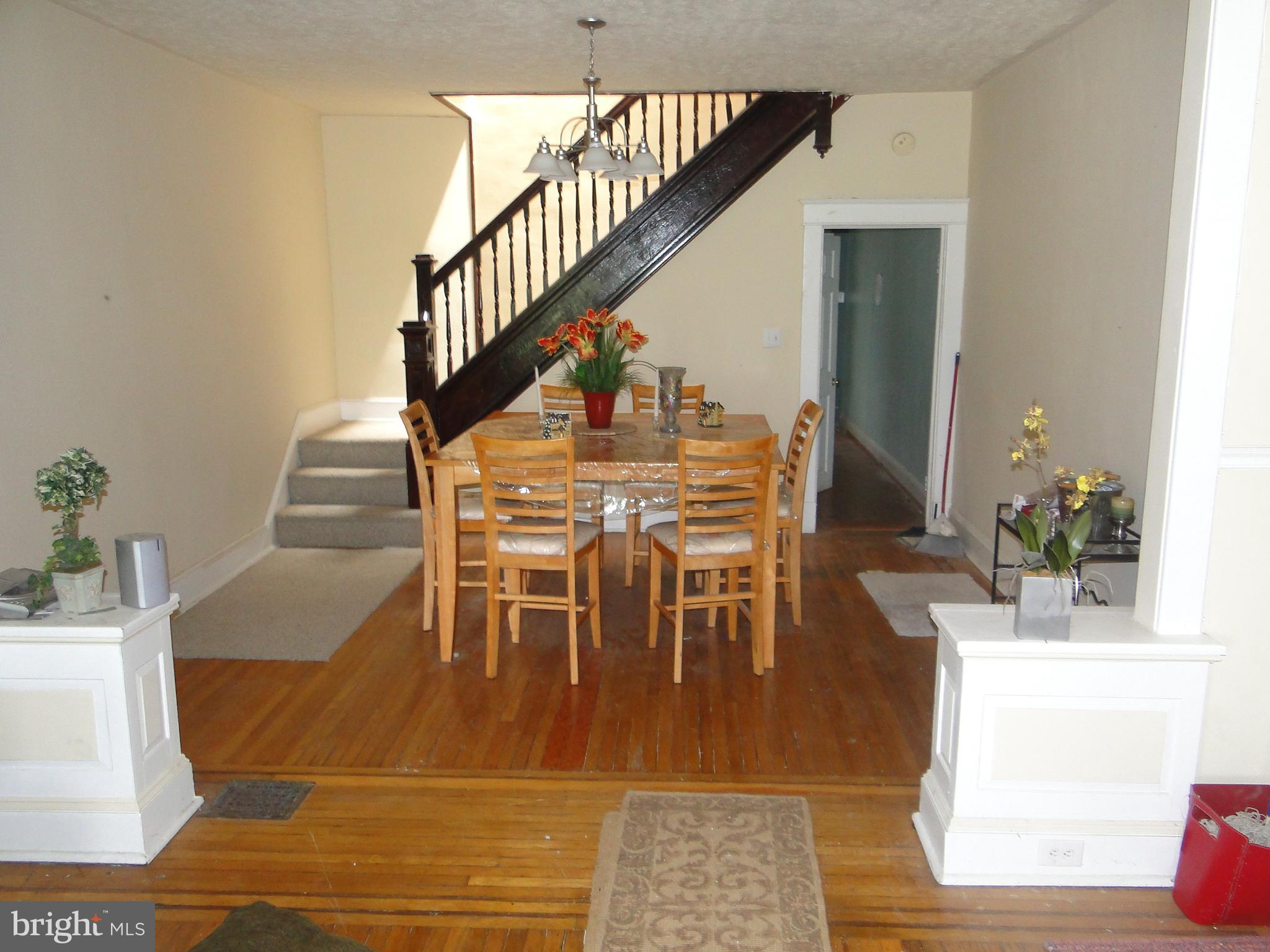 3019 Belair Road Baltimore, MD 21213 - Photo 4 of 11 a dining room with furniture entryway and wooden floor
