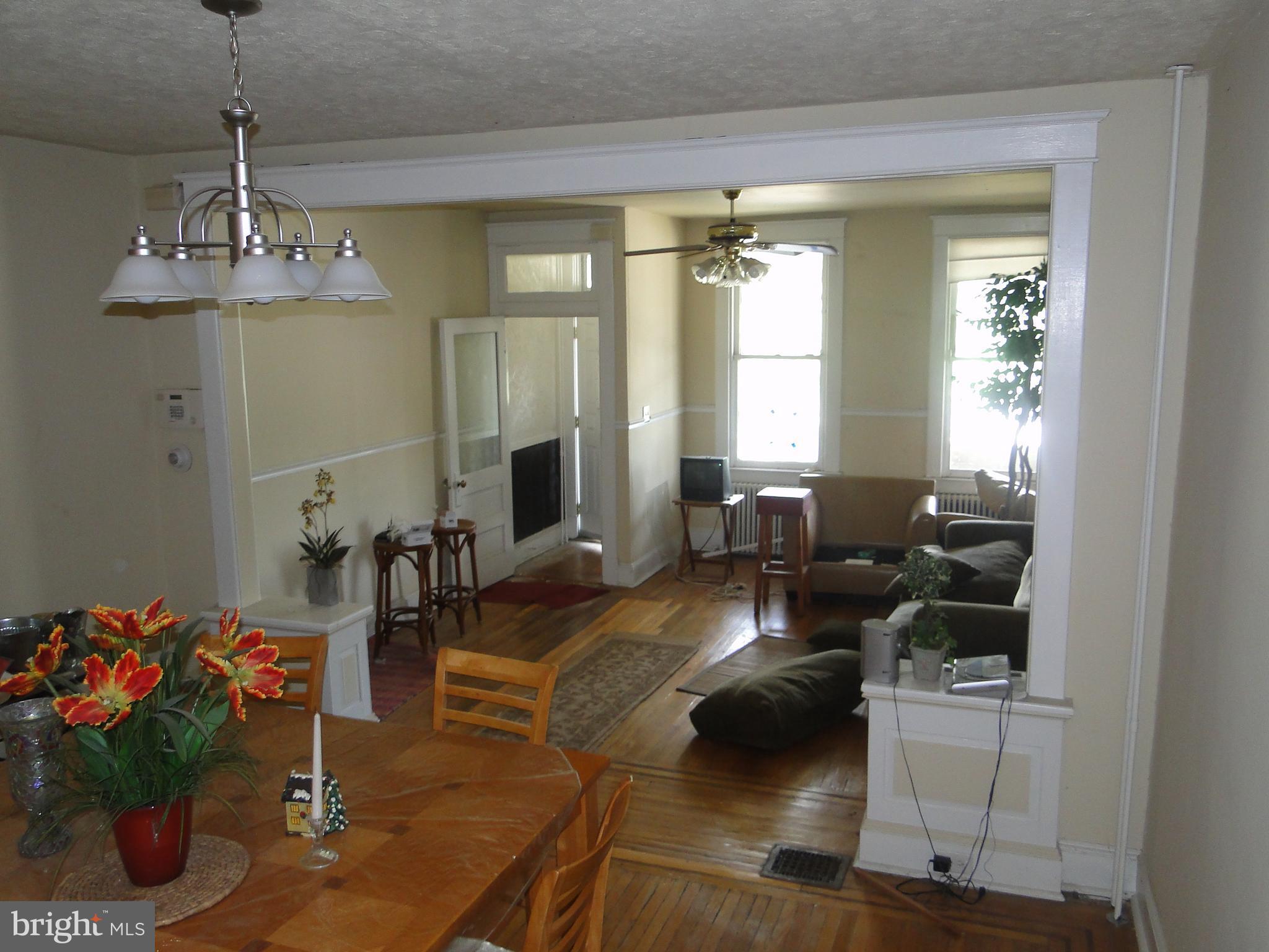 3019 Belair Road Baltimore, MD 21213 - Photo 5 of 11 a living room with furniture and a chandelier