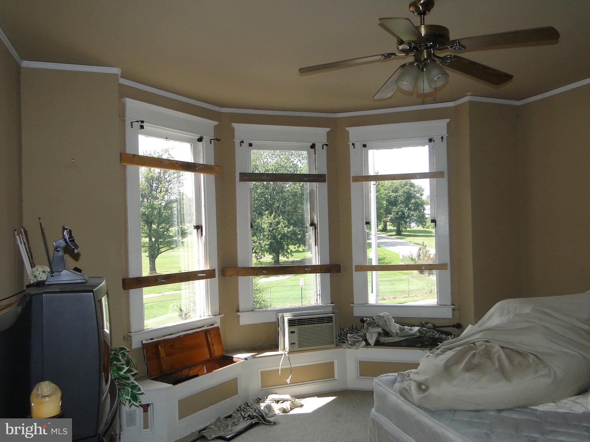 3019 Belair Road Baltimore, MD 21213 - Photo 8 of 11 a living room with furniture and a window
