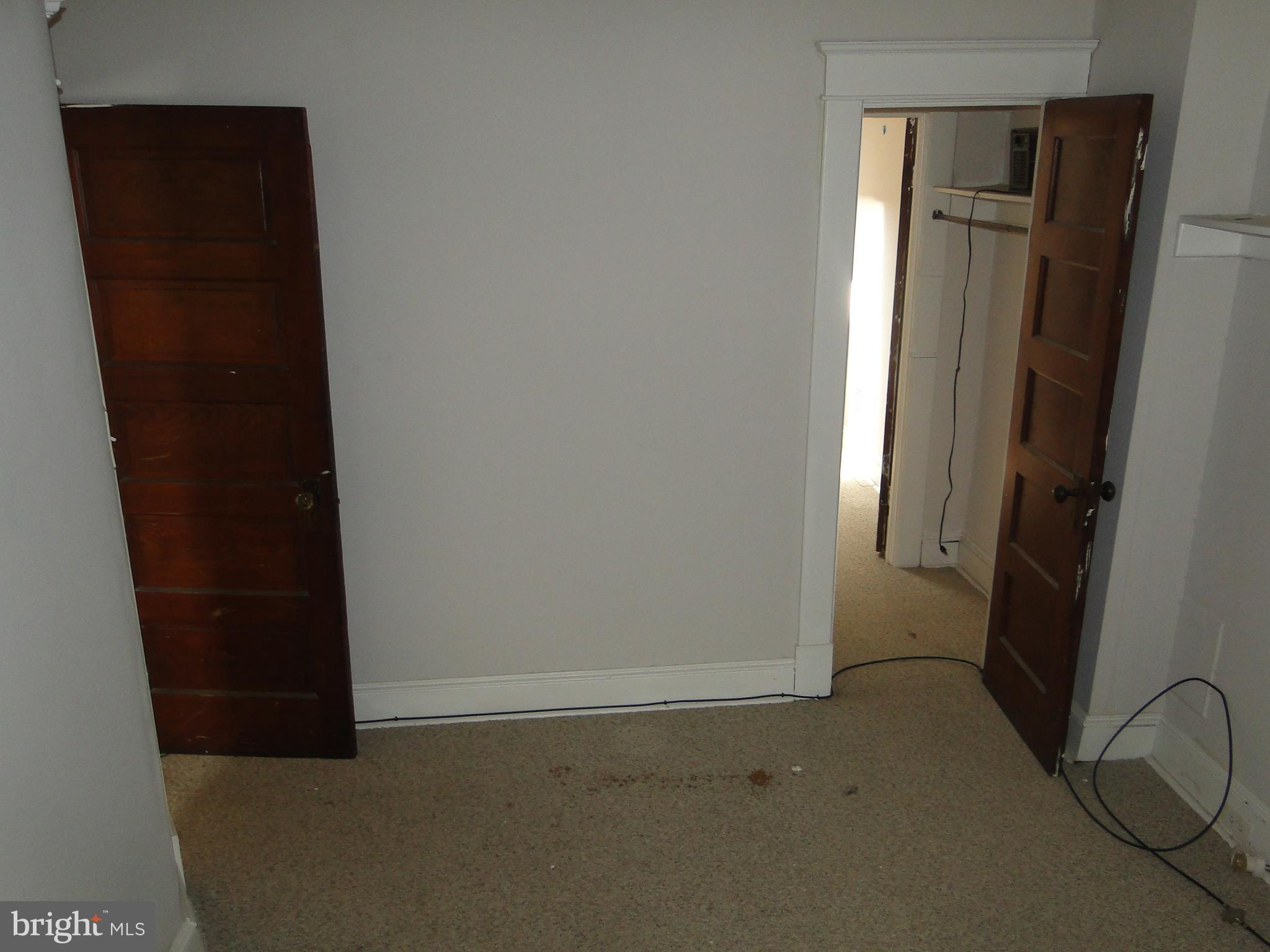 3019 Belair Road Baltimore, MD 21213 - Photo 9 of 11 an empty room with windows