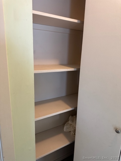 585 Park Road, Unit 108 Waterbury, CT 06708 - Photo 12 of 13 a bathroom with a toilet and white door