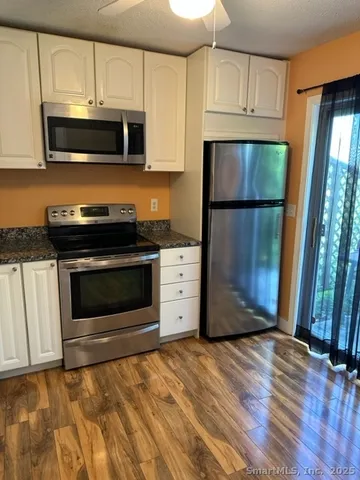 a kitchen with a stove and a microwave