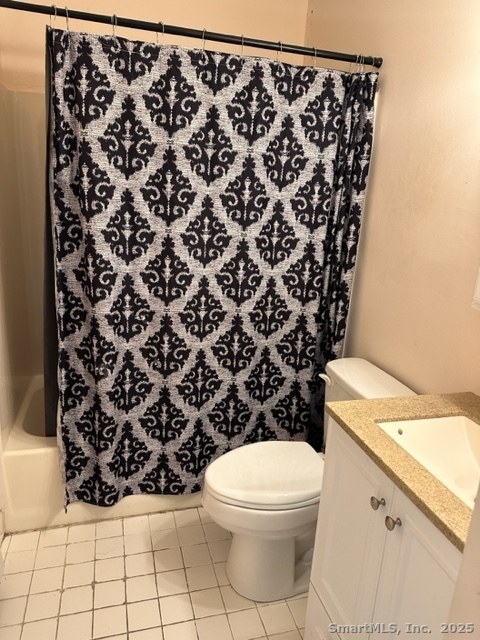 585 Park Road, Unit 108 Waterbury, CT 06708 - Photo 8 of 13 a bathroom with a toilet and a shower curtain