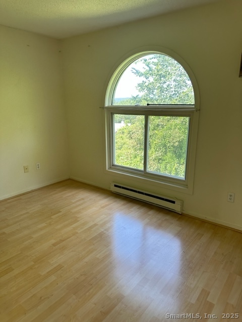 585 Park Road, Unit 108 Waterbury, CT 06708 - Photo 10 of 13 an empty room with a window