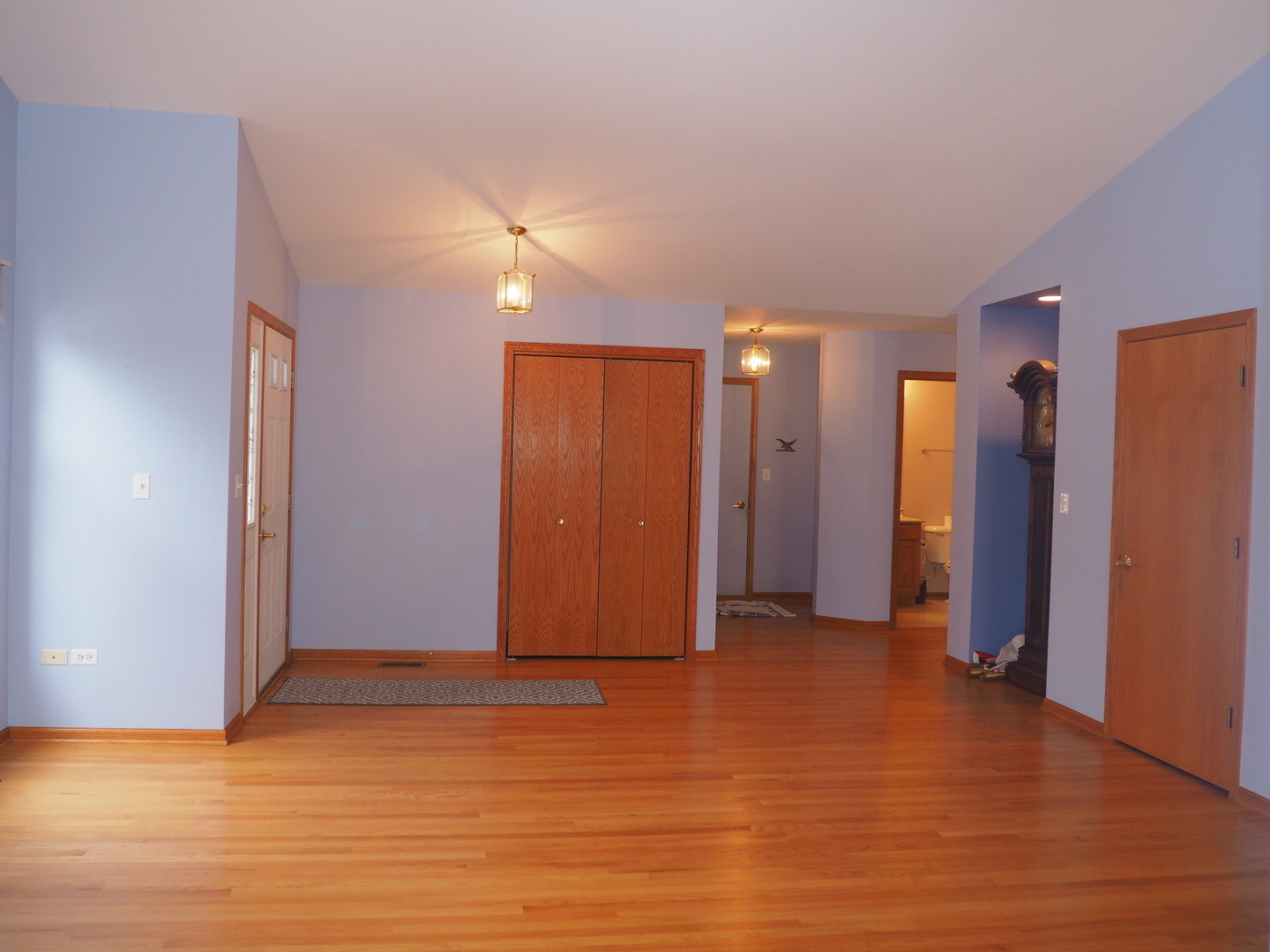 11904 Somerset Road Orland Park, IL 60467 - Photo 11 of 38 a view of an empty room with wooden floor and a ceiling fan