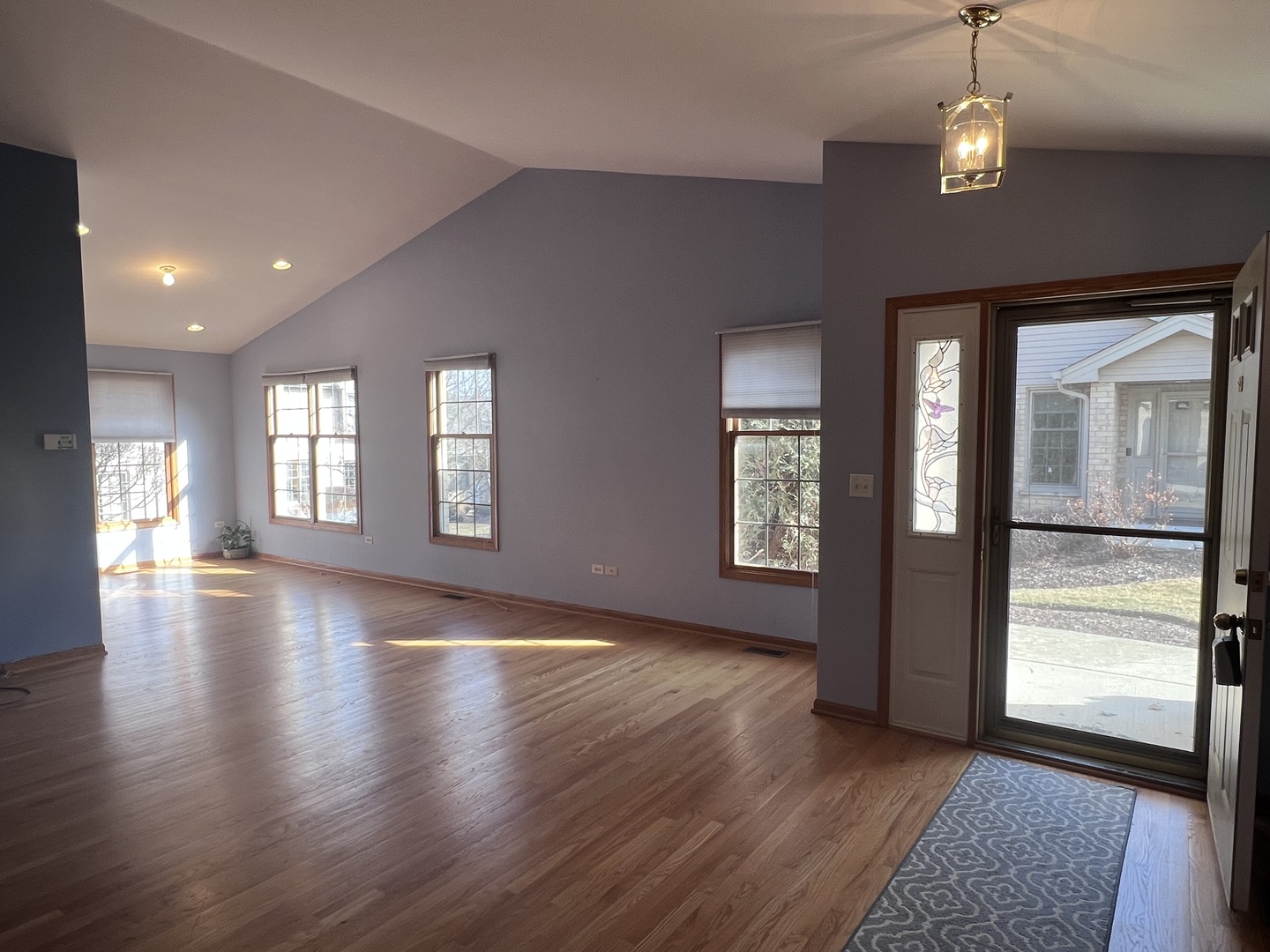 11904 Somerset Road Orland Park, IL 60467 - Photo 7 of 38 an empty room with wooden floor and windows