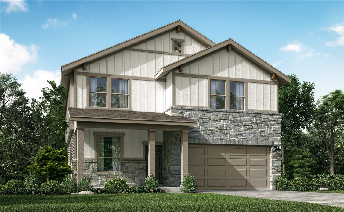 a front view of a house with a yard and potted plants